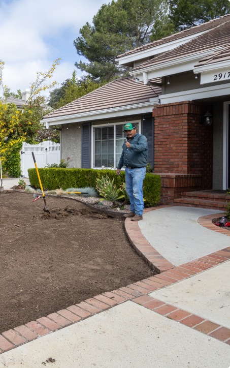 A man laying grass